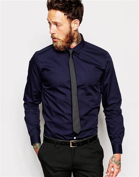 navy blue shirt and tie.